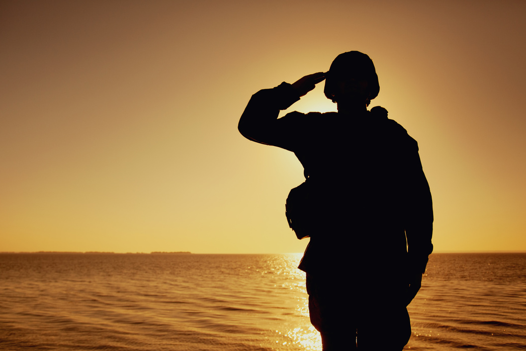 Silhouette of Soldier Saluting